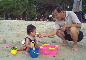 Robyn and Grandpa at the beach