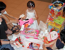 Everyone helped me with unwrapping the presents