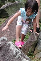 Robyn scrambling on rocks