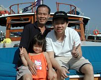 Grandpa, Melvin & Robyn on the yacht