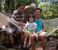 Grandpa, Robyn and Alvin relaxing in hammock