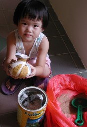 Robyn doing sawdust pottery firing