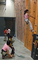 Putting her newly acquired belaying skills to test, Robyn belays Jing Yun