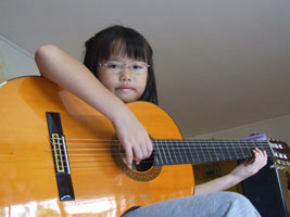 Robyn plays the guitar