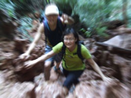 Alvin and Jin scrambling up rocks