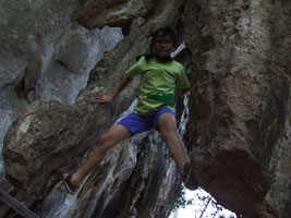 Robyn climbing on stalactites