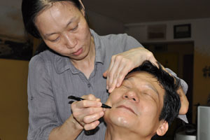 Granny and Jo jo massaging uncle ah hua