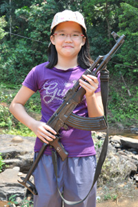 Robyn with AK-47 assault rifle