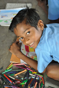 The younger kids here use crayons and they drew with immense concentration.