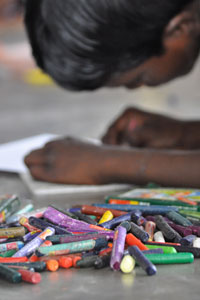 These kids sat lining the entire corridor to do their drawing.