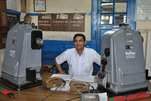 Station master with train control mechanism.