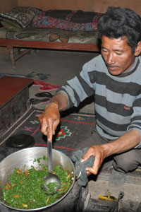 Tsering boiled the leaves in a pressure cooker, and then expertly fried them in a wok over a stove that uses cow and donkey dungs as fuel.