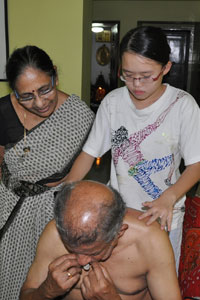 Robyn showing Aunt Geetha how to locate the acupoints