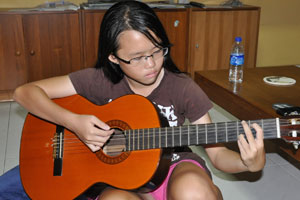Robyn on guitar