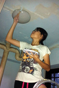 Robyn painting the ceiling