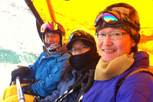 Song Jian, Robyn and Jin going up in a chairlift with heated seats!